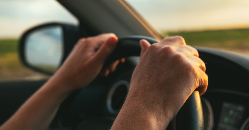 hand in the steering wheel